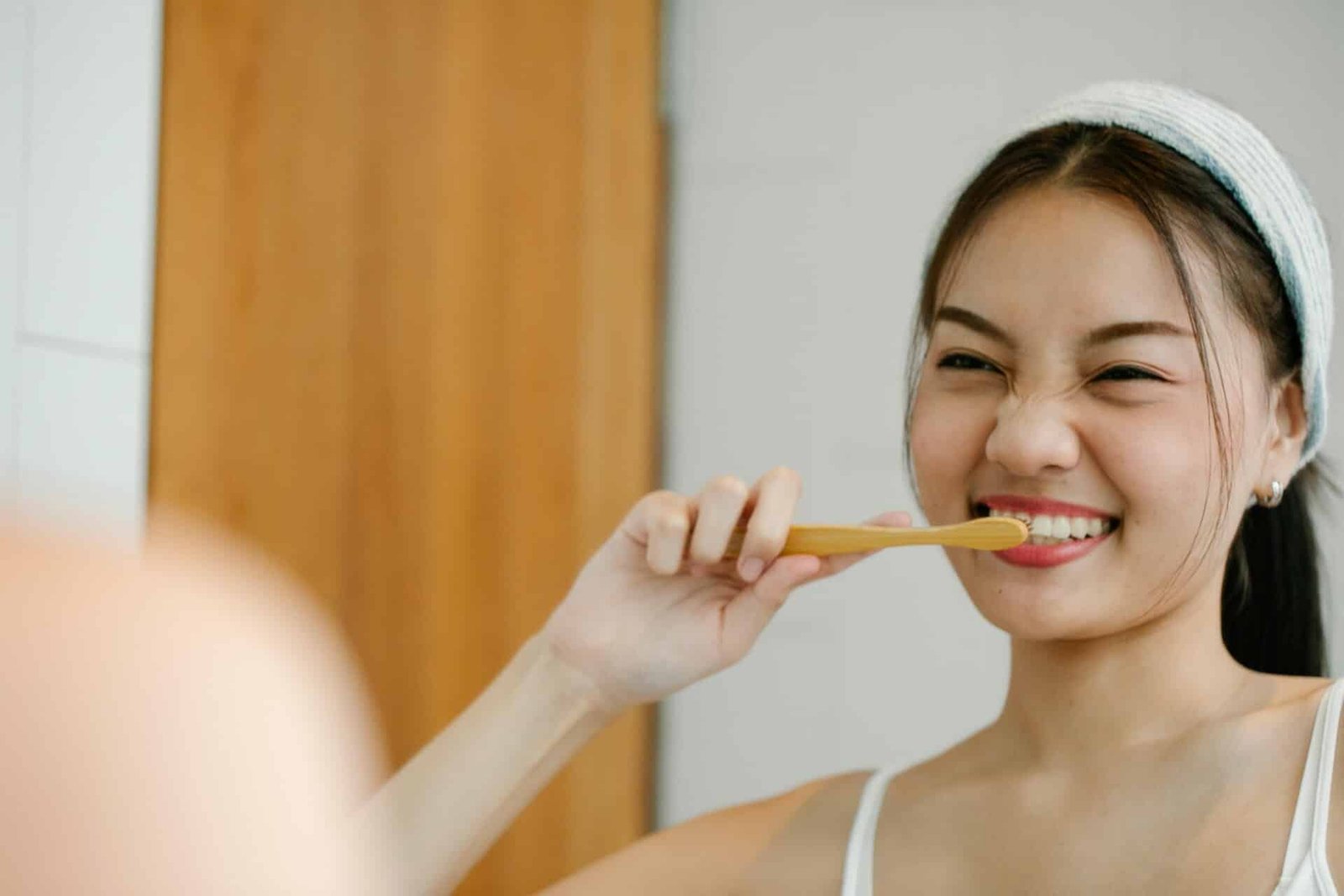 A woman brushing her teeth.
