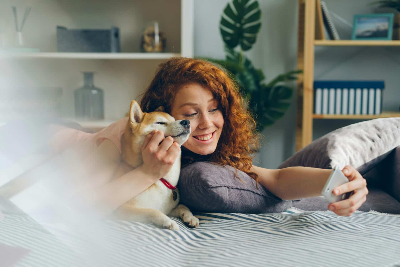 A woman and her dog taking a selfie.
